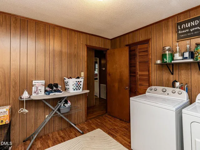 a bedroom with a bed and flat screen tv
