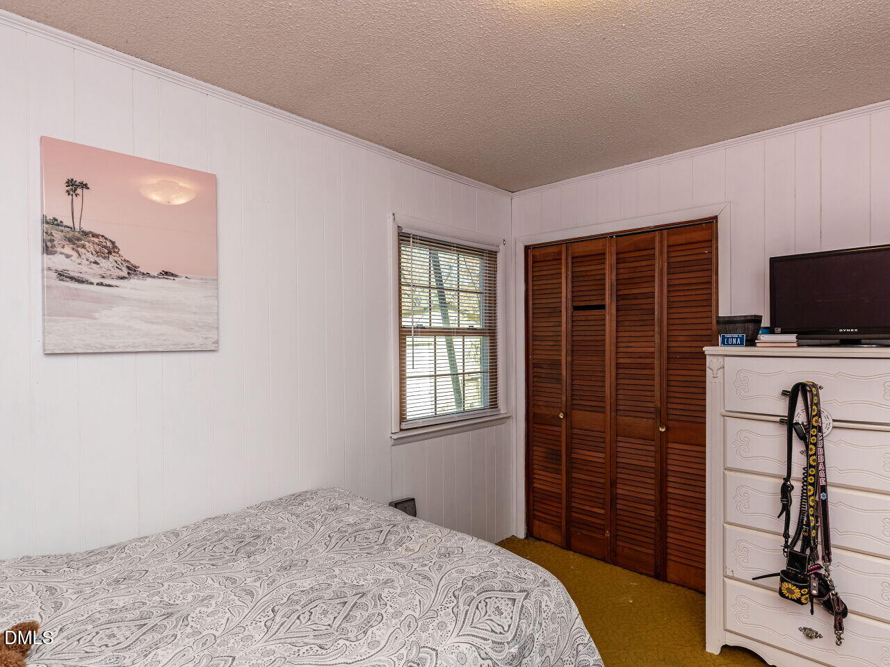 269 Beaver Dam Road Norlina, NC 27563 - Photo 26 of 38 a bedroom with a bed and flat screen tv