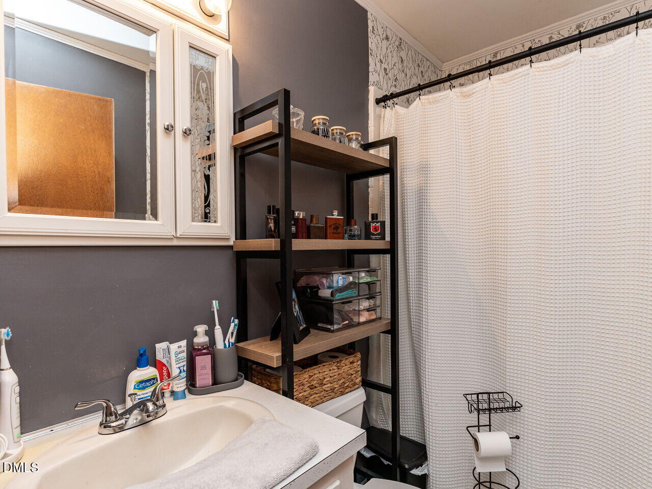 269 Beaver Dam Road Norlina, NC 27563 - Photo 27 of 38 a bathroom with a sink a toilet and shower curtain
