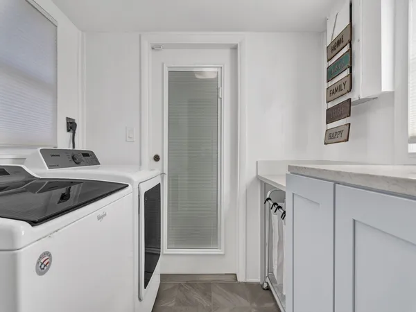 a view of a house with backyard porch and sitting area