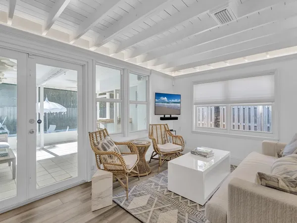 a bedroom with two beds and a window