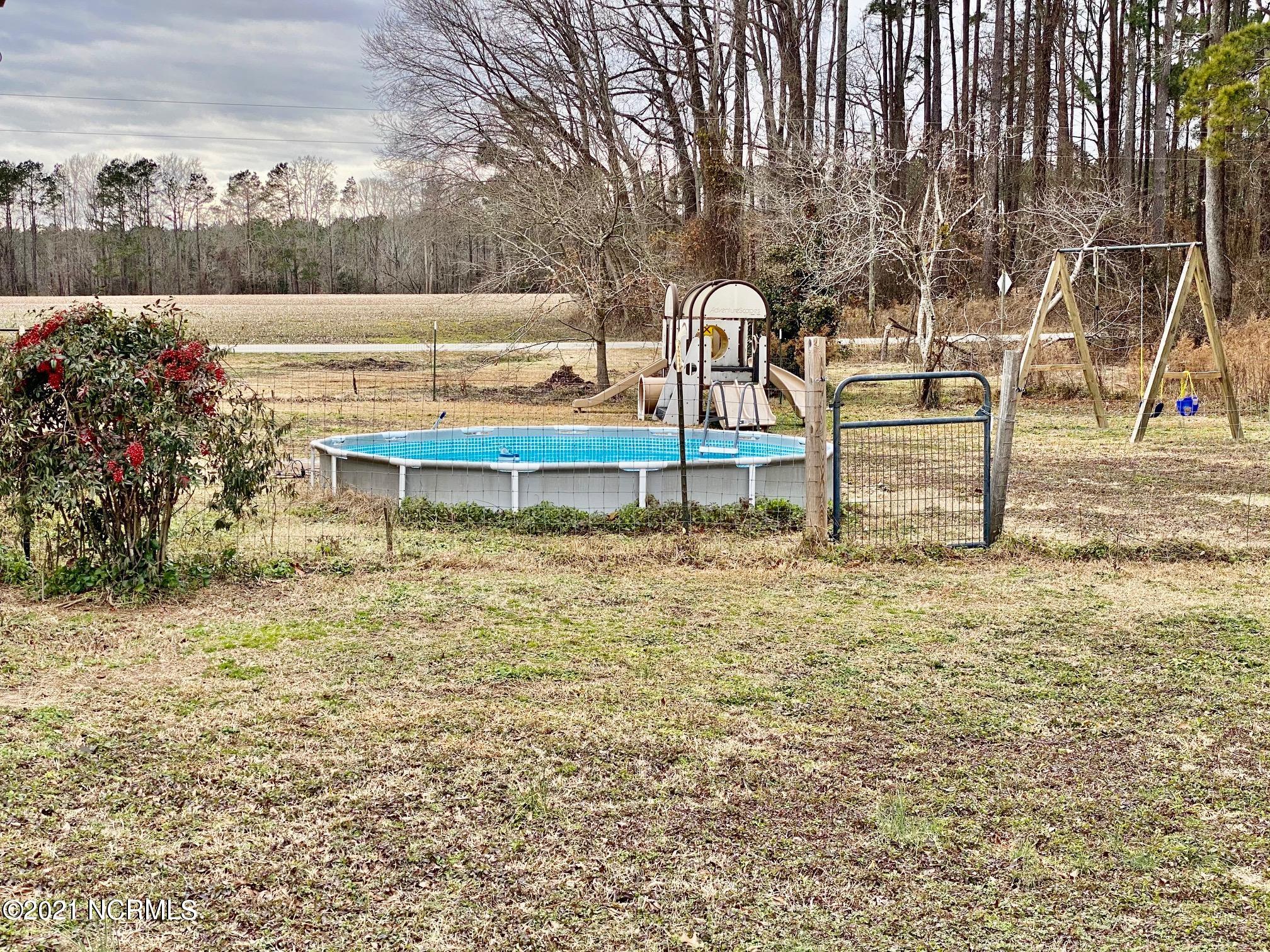 1361 Poplar Point Road Williamston, NC 27892 - Photo 50 of 58 Side Yard View with Kid size Pool & other Play Items