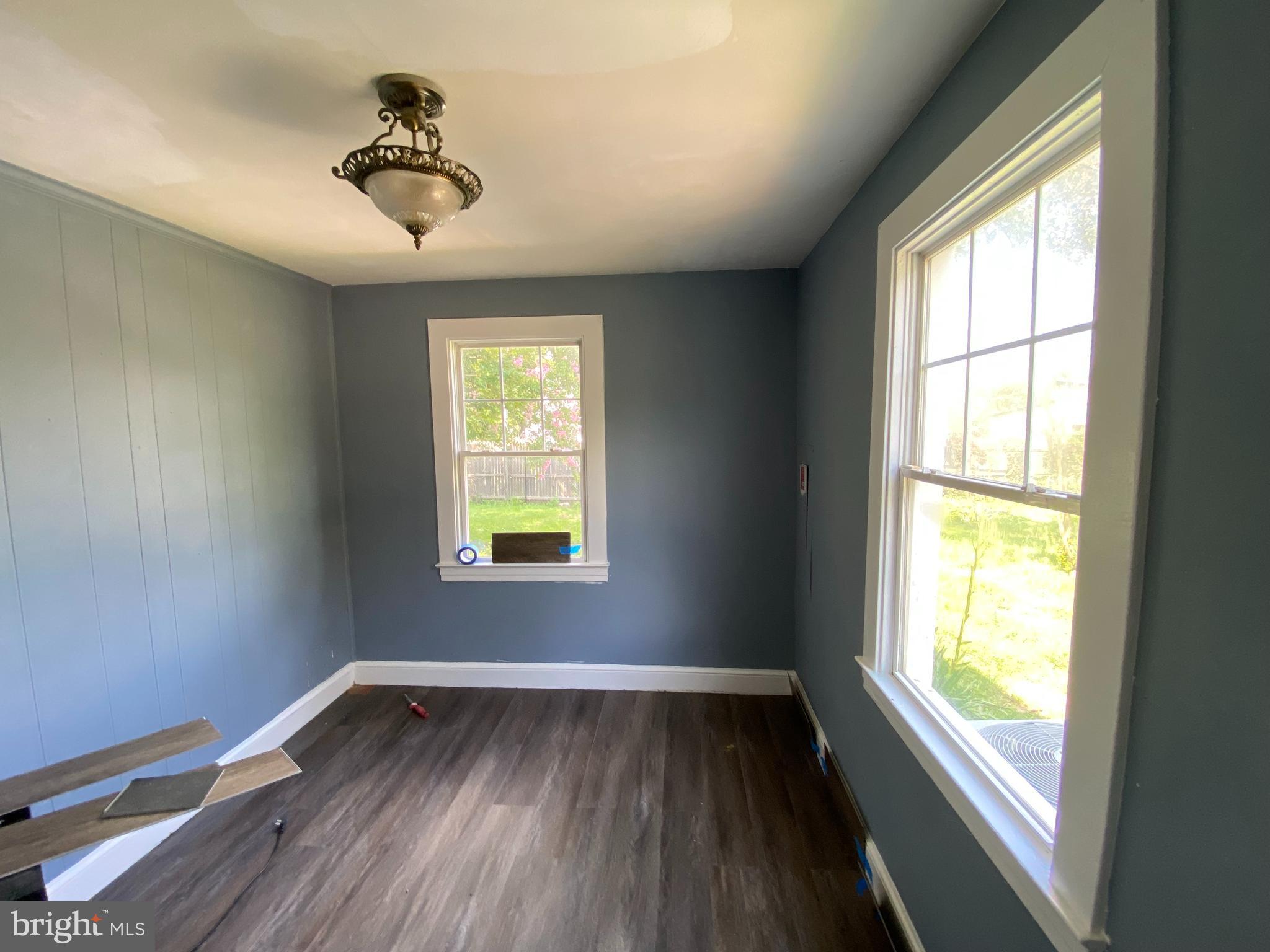 13304 Crain Highway Brandywine, MD 20613 - Photo 11 of 17 a view of room with hardwood floor and windows