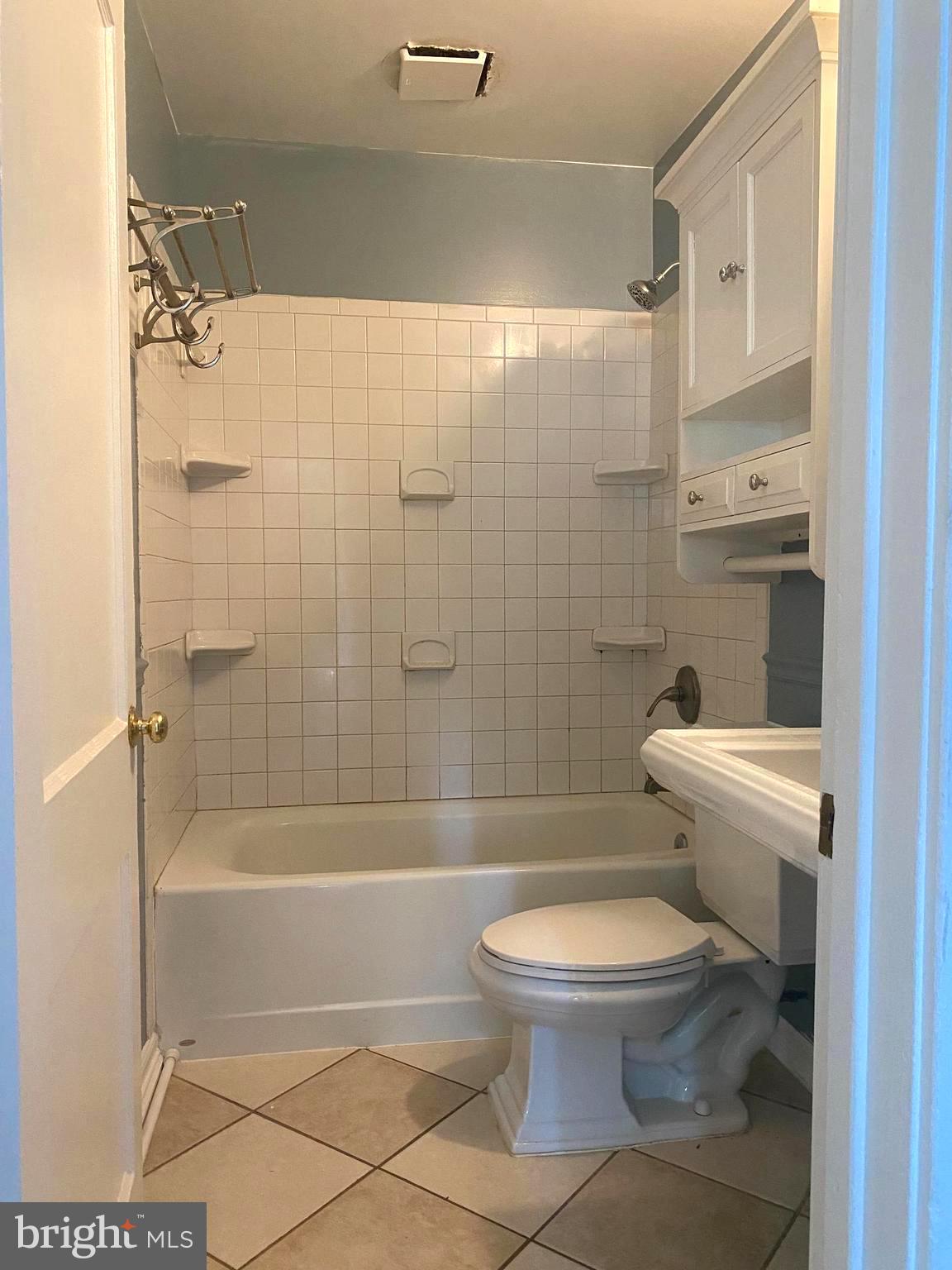 13304 Crain Highway Brandywine, MD 20613 - Photo 14 of 17 a bathroom with a toilet and a shower