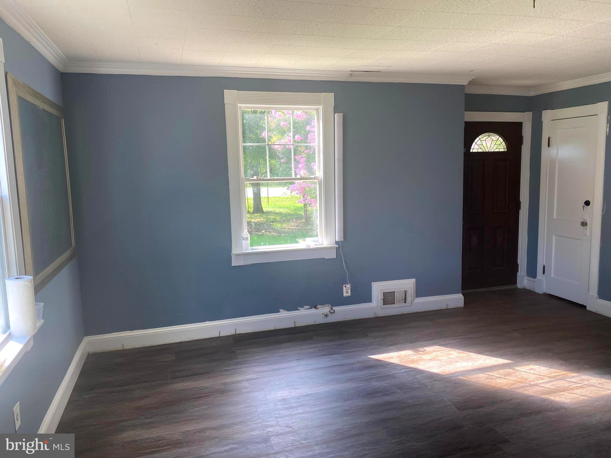 13304 Crain Highway Brandywine, MD 20613 - Photo 17 of 17 an empty room with wooden floor and windows