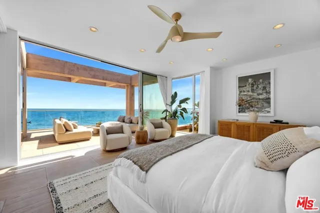 a bedroom with a large bed and a couch