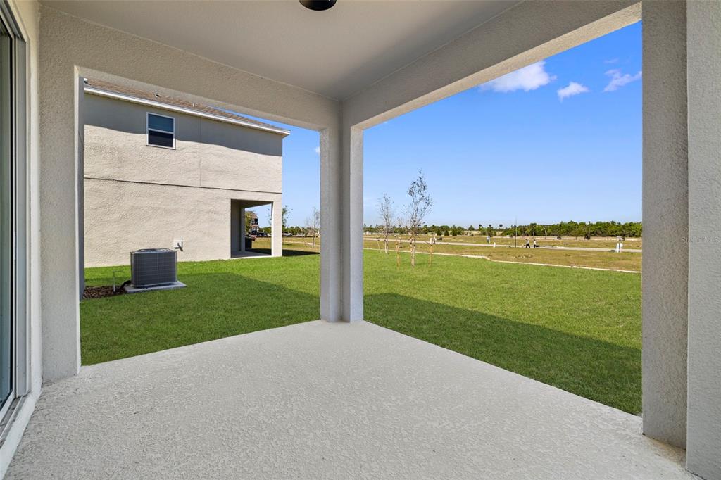 7120 Cherry Pasture Road Groveland, FL 34736 - Photo 13 of 23 a view of a big room with a big yard and potted plants