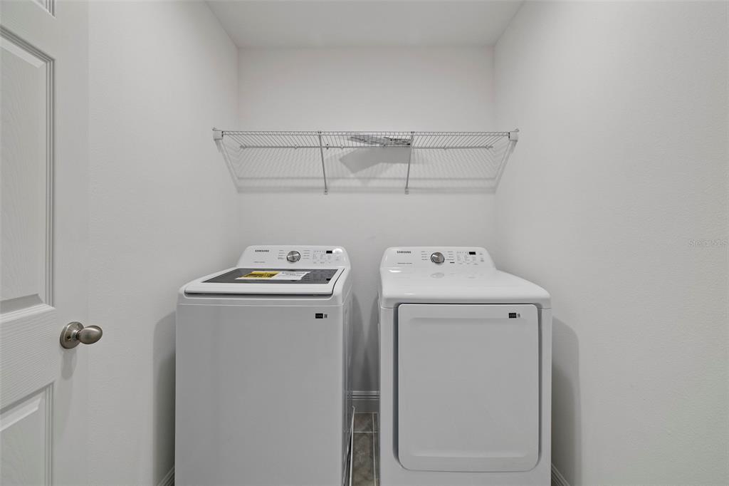 7120 Cherry Pasture Road Groveland, FL 34736 - Photo 10 of 23 a utility room with dryer and washer