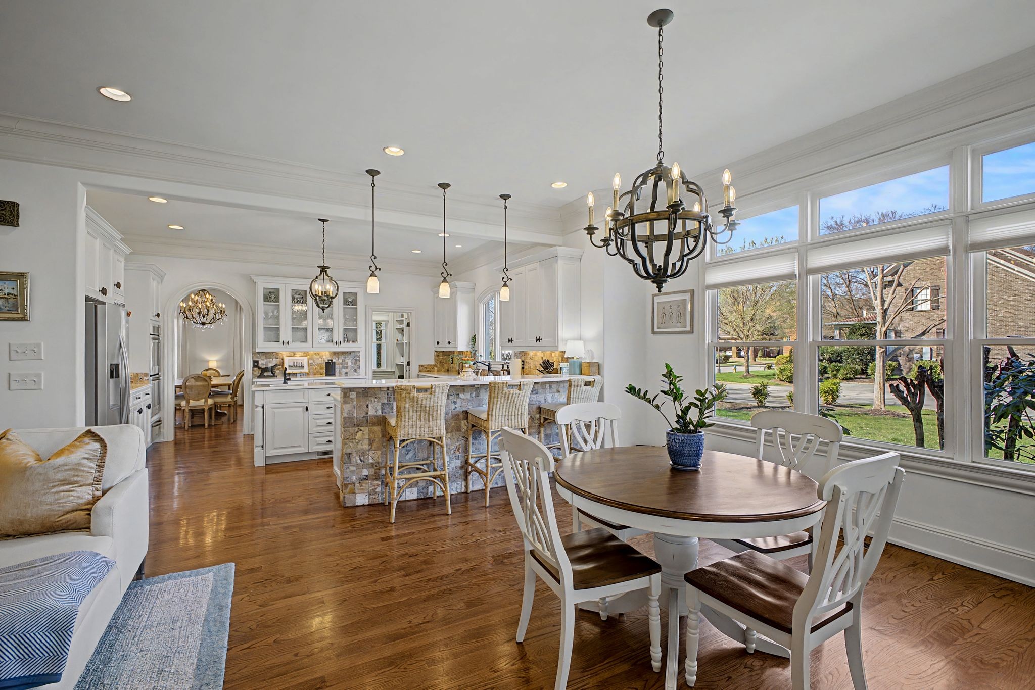 626 Band Drive Franklin, TN 37064 - Photo 16 of 53 a dining room with furniture a chandelier and wooden floor