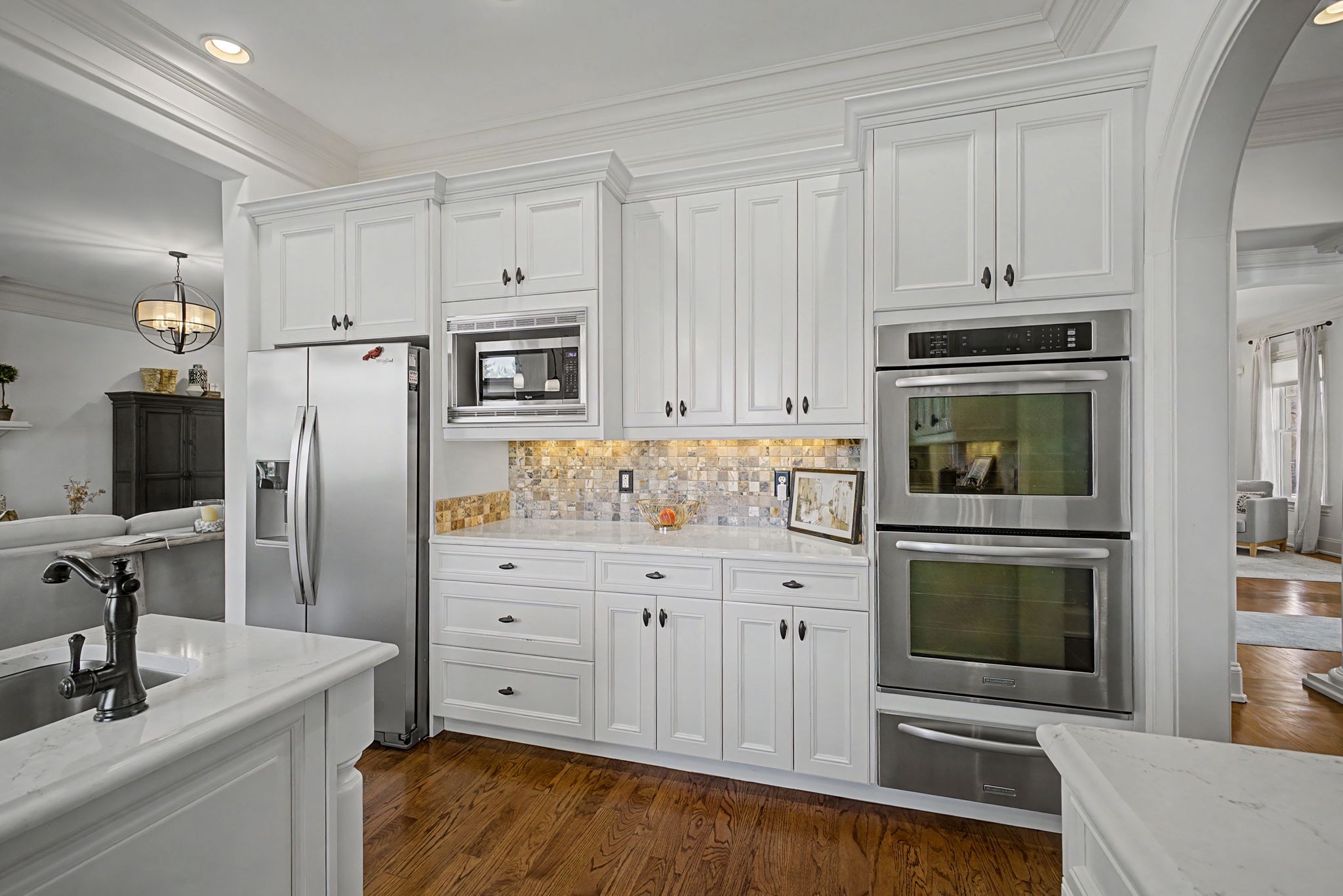 626 Band Drive Franklin, TN 37064 - Photo 21 of 53 a kitchen with granite countertop white cabinets and stainless steel appliances