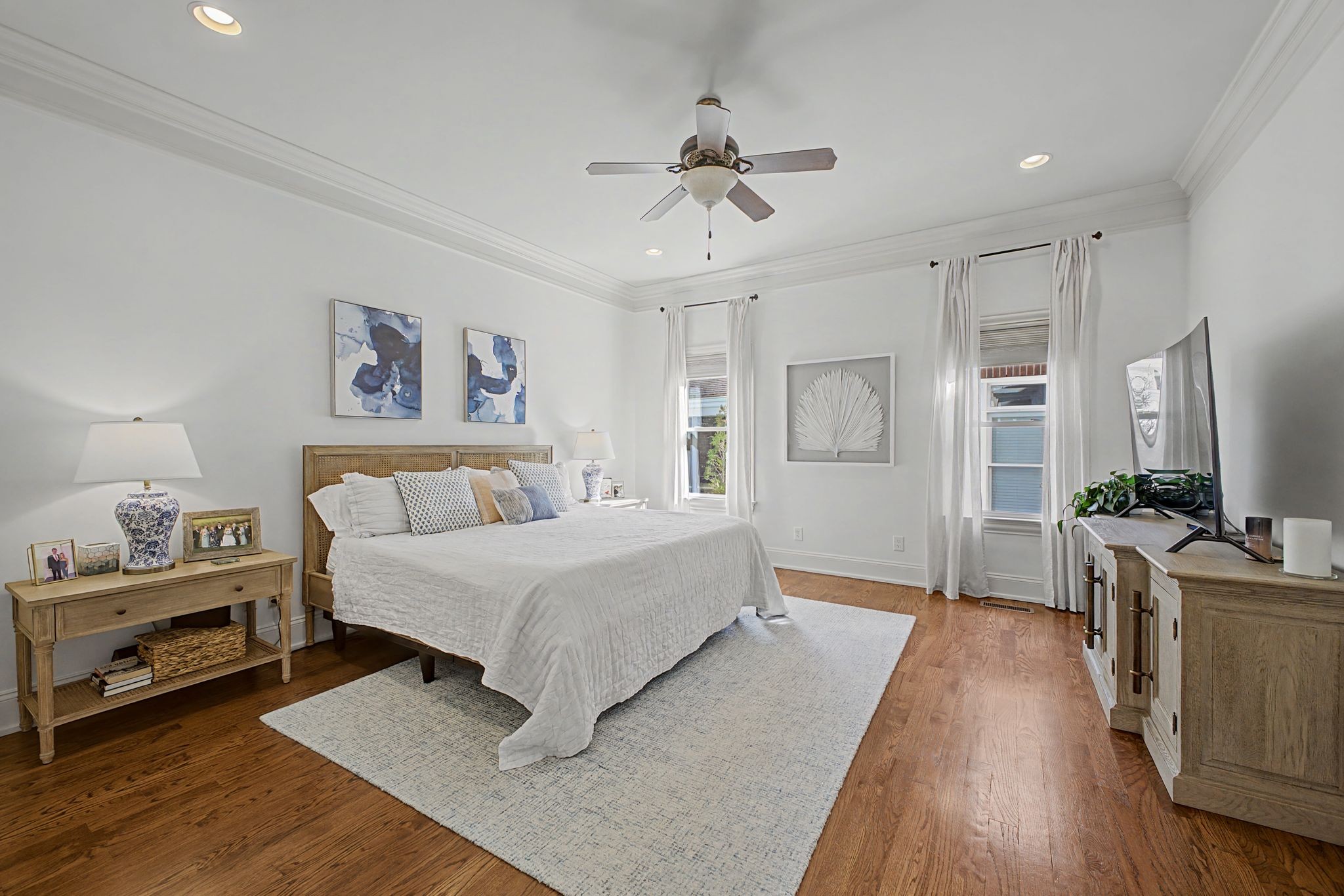 626 Band Drive Franklin, TN 37064 - Photo 24 of 53 a spacious bedroom with a bed and a chandelier