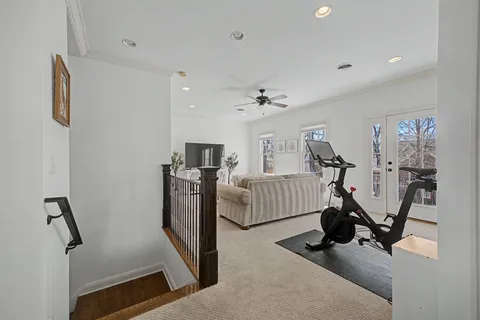 a view of a livingroom with furniture and a flat screen tv