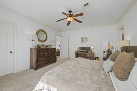 a bathroom with a granite countertop toilet sink and a mirror