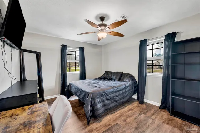 a bedroom with a bed and a walk in closet