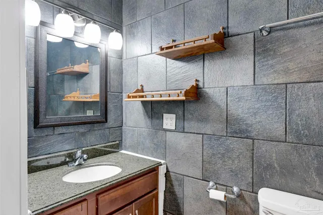 a bathroom with a sink and mirror