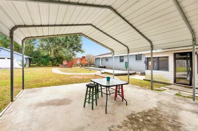 a view of a swimming pool with a patio