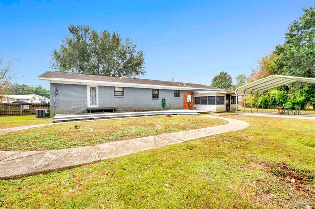a house view with swimming pool in front of it