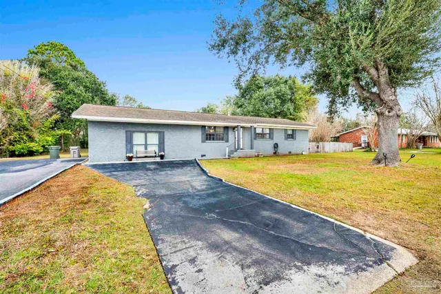 a view of swimming pool with outdoor seating and yard