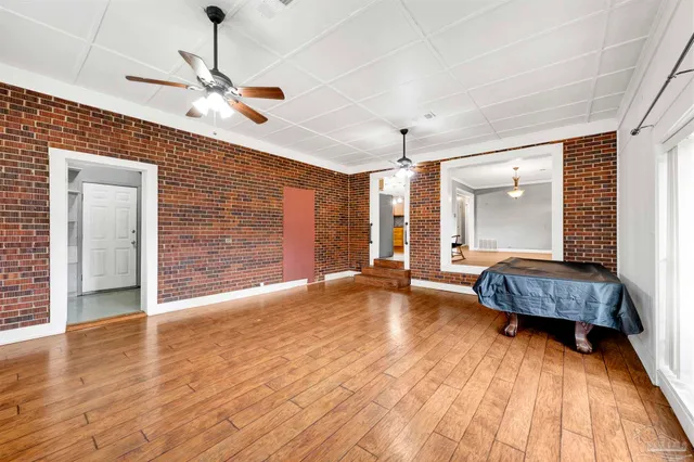 a living room with a bed furniture and a window