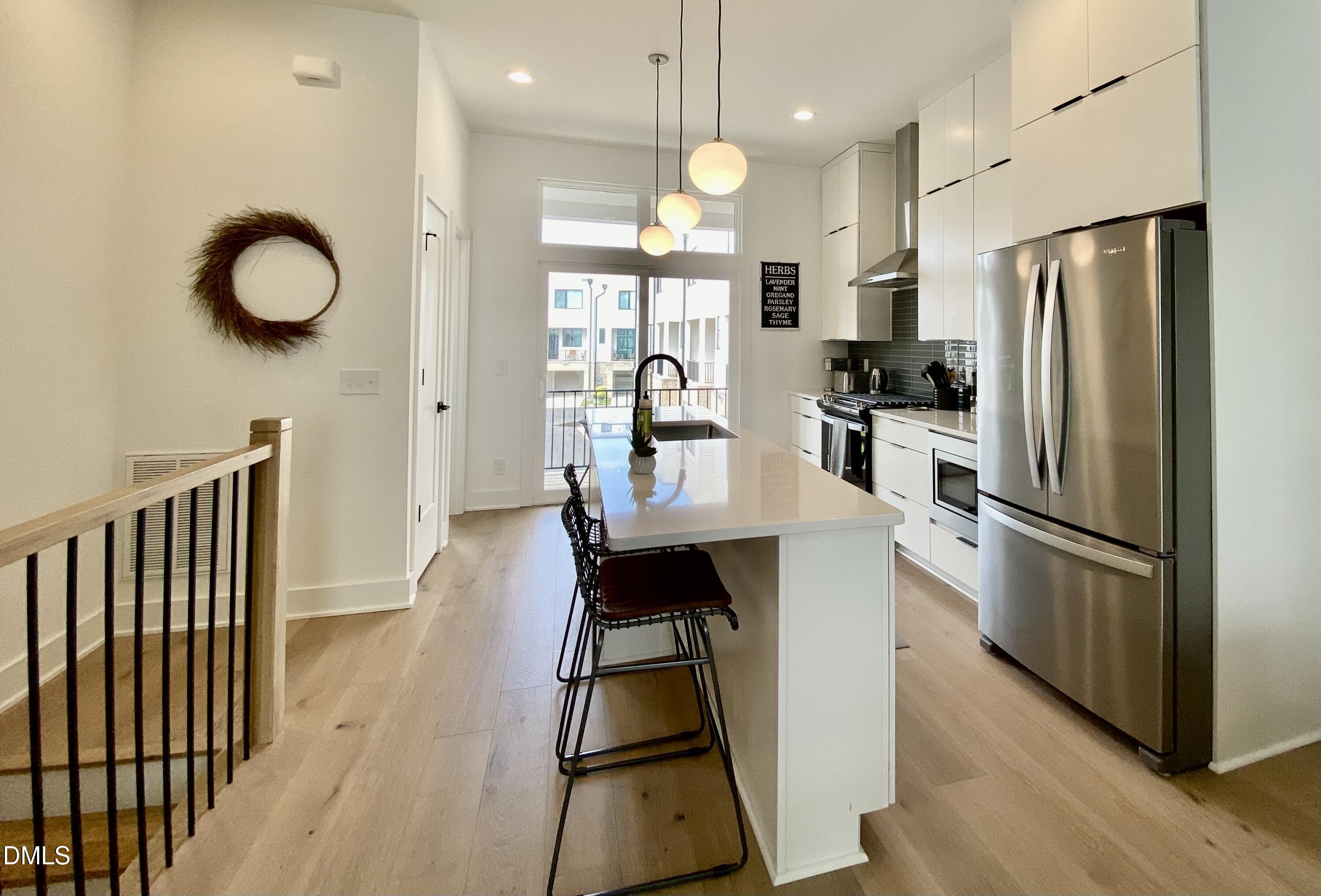 629 North Queen Street Durham, NC 27701 - Photo 15 of 58 a kitchen with stainless steel appliances granite countertop a refrigerator stove microwave and sink