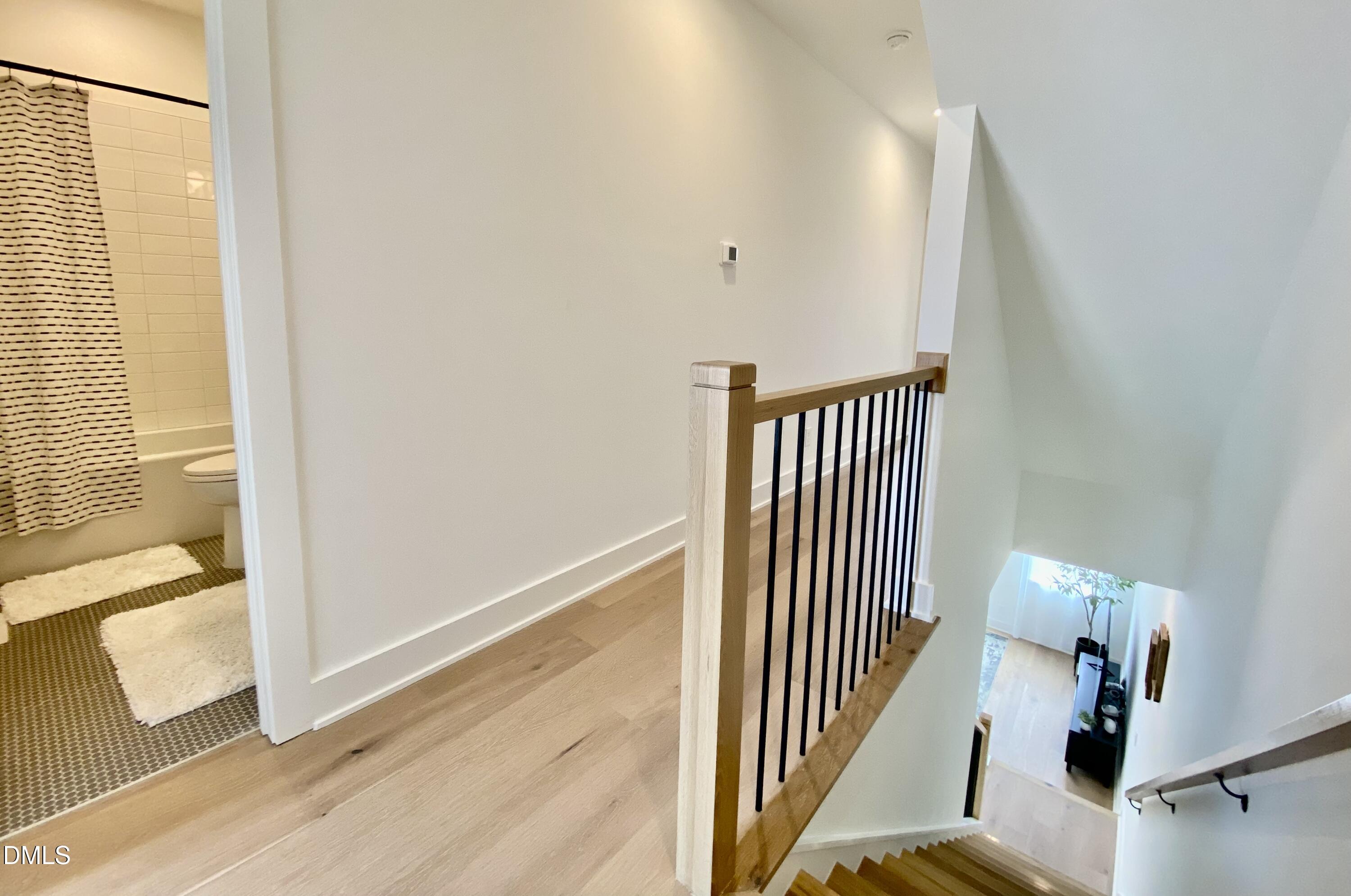 629 North Queen Street Durham, NC 27701 - Photo 27 of 58 a view of a hallway with wooden floor and entryway