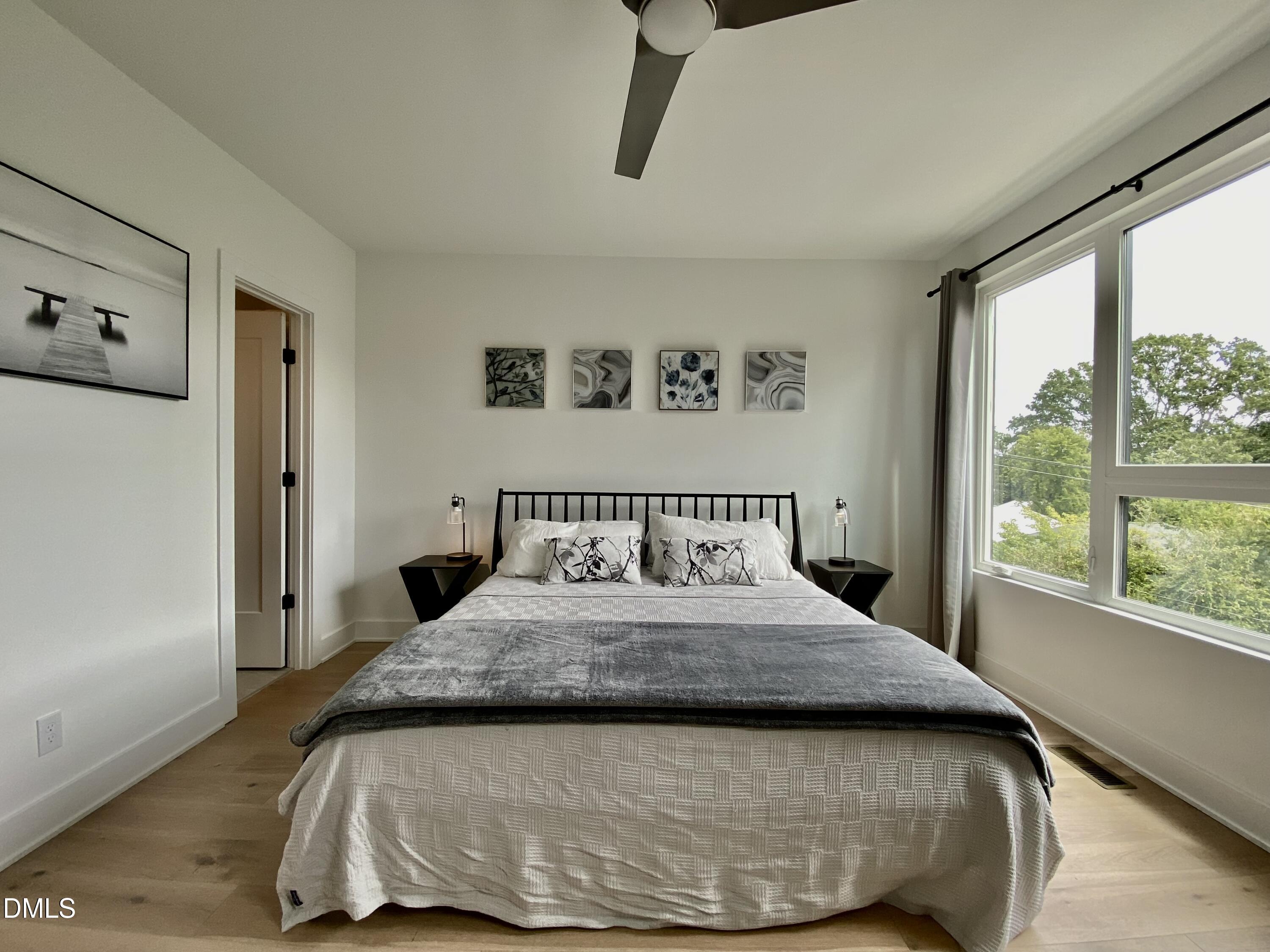 629 North Queen Street Durham, NC 27701 - Photo 38 of 58 a bedroom with a bed and window