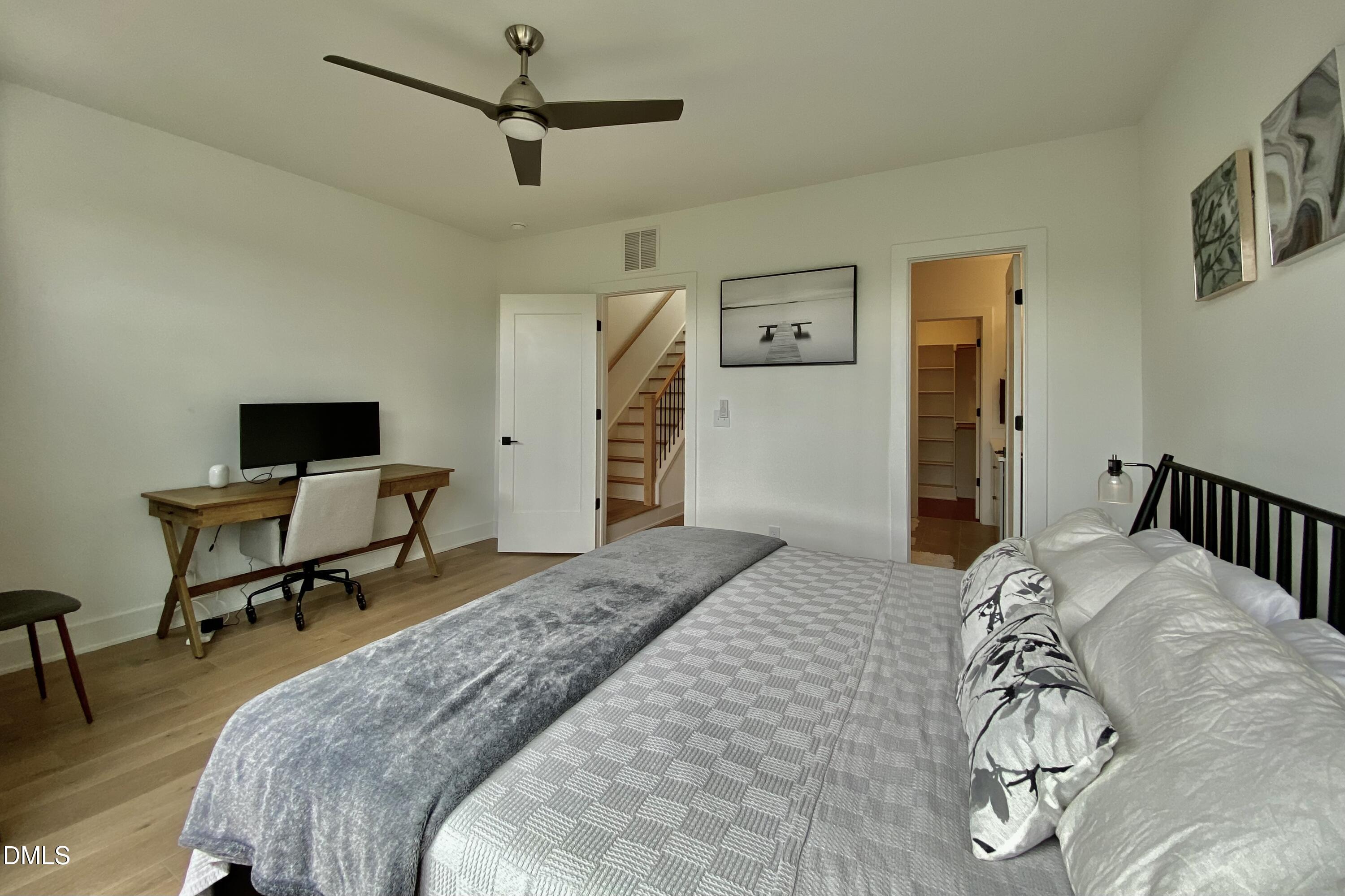 629 North Queen Street Durham, NC 27701 - Photo 39 of 58 a bedroom with a bed and a table