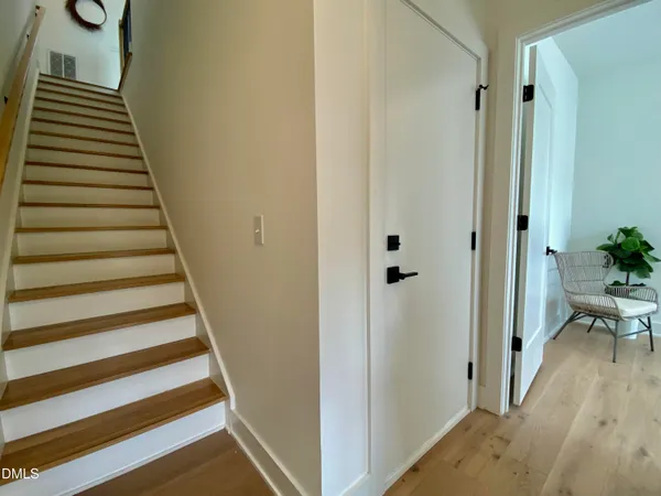 an empty room with windows and cabinet