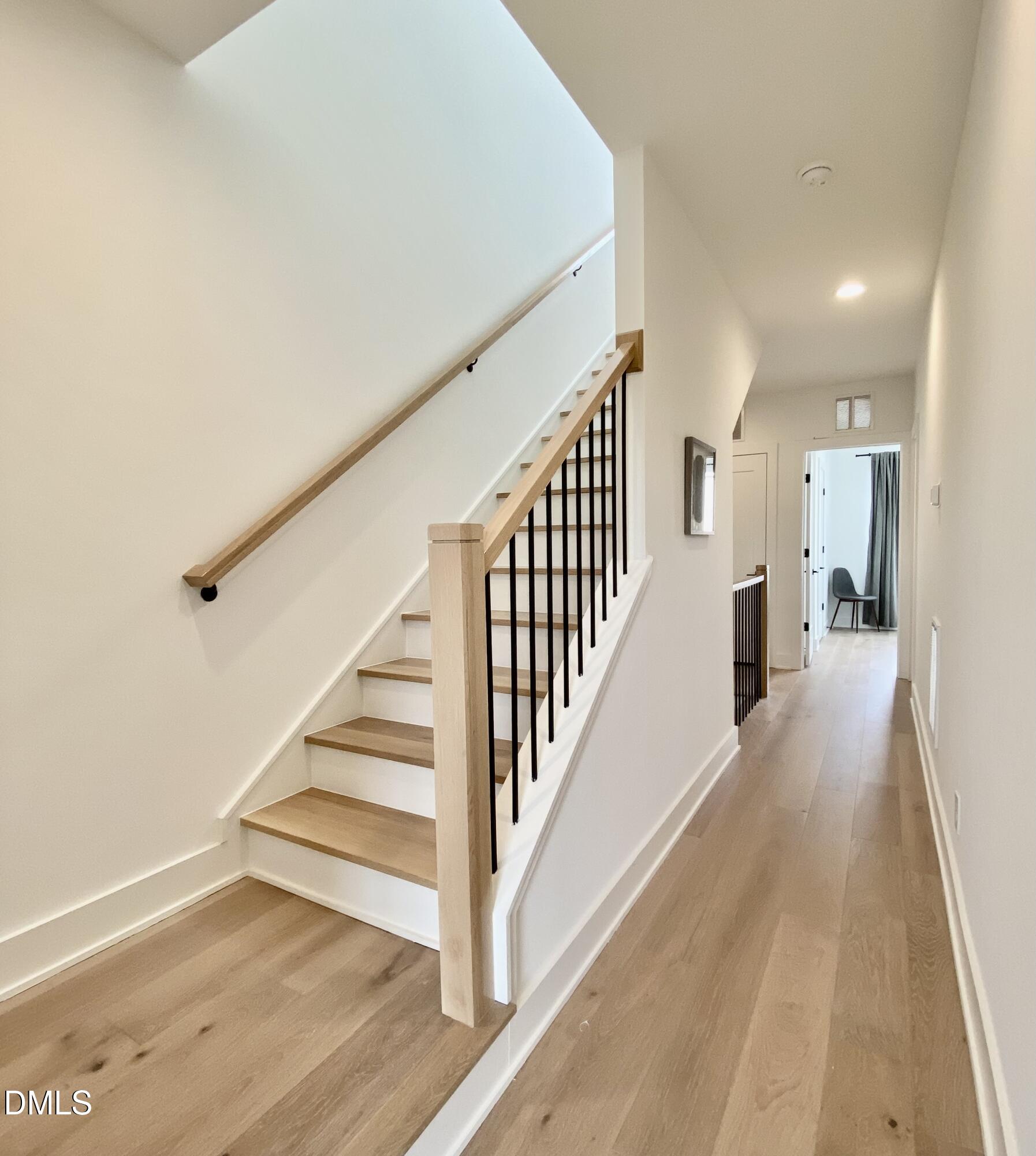 629 North Queen Street Durham, NC 27701 - Photo 46 of 58 a view of a hallway with wooden floor and entryway