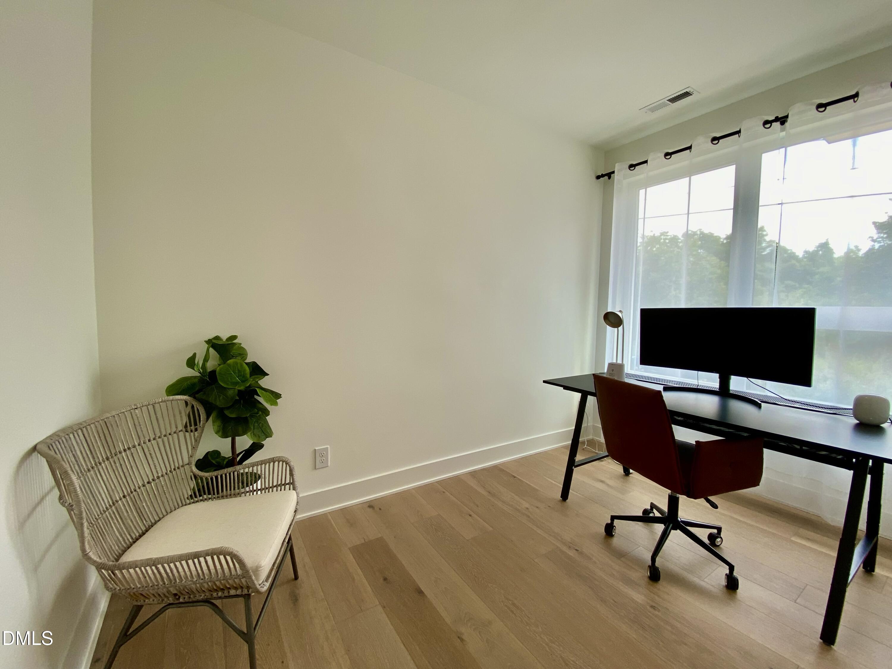 629 North Queen Street Durham, NC 27701 - Photo 7 of 58 a living room with furniture wooden floor and a flat screen tv