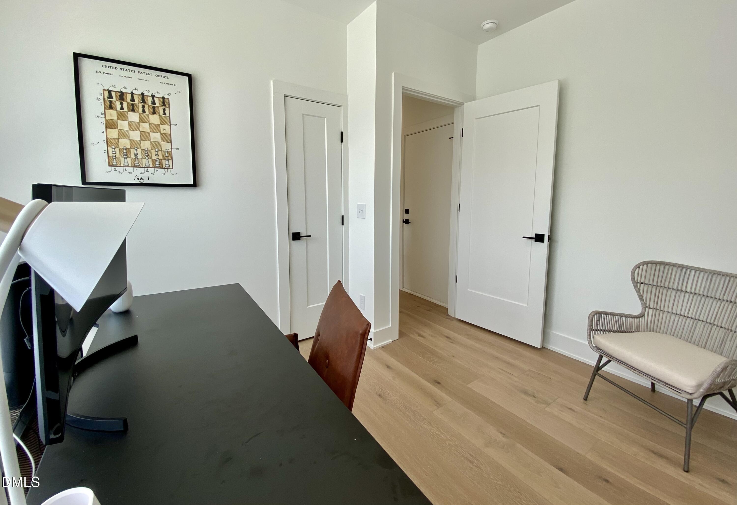 629 North Queen Street Durham, NC 27701 - Photo 8 of 58 a living room with a bed and furniture