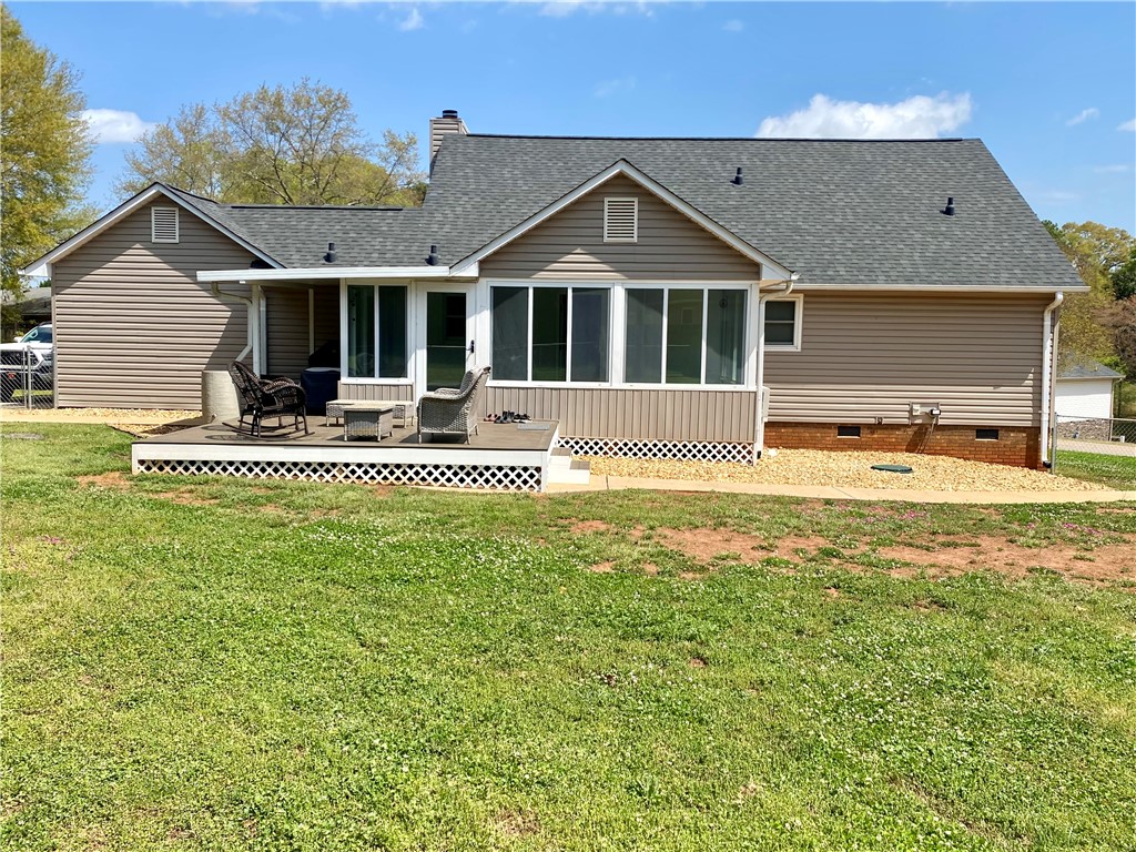 210 Twin Lakes Drive Anderson, SC 29621 - Photo 13 of 44 This residence features a comfortable deck and a spacious yard, perfect for outdoor enjoyment.