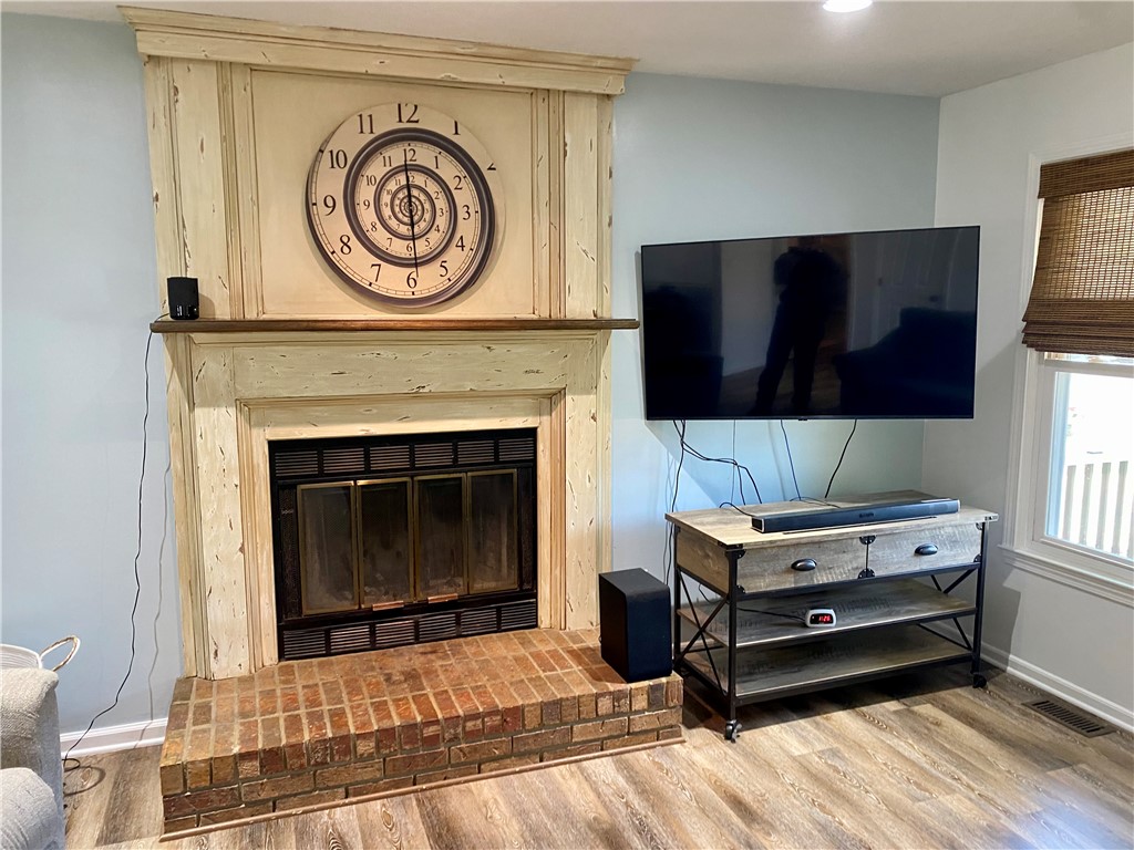 210 Twin Lakes Drive Anderson, SC 29621 - Photo 14 of 44 This inviting living space features a charming fireplace, creating a cozy ambiance.