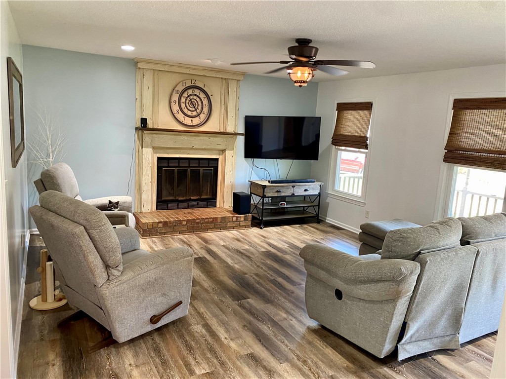 210 Twin Lakes Drive Anderson, SC 29621 - Photo 15 of 44 This inviting living space features a cozy fireplace and abundant natural light.