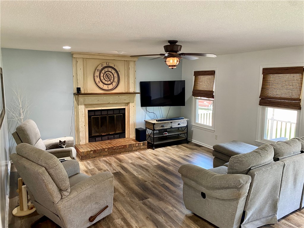 210 Twin Lakes Drive Anderson, SC 29621 - Photo 16 of 44 This inviting living space features warm flooring, creating a cozy and comfortable atmosphere perfect for gatherings.