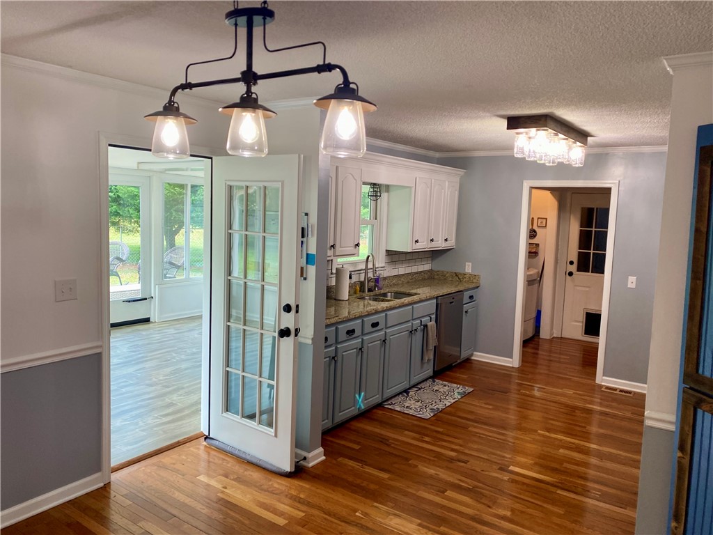 210 Twin Lakes Drive Anderson, SC 29621 - Photo 18 of 44 This spacious kitchen features hardwood flooring, modern cabinetry, and ample counter space.