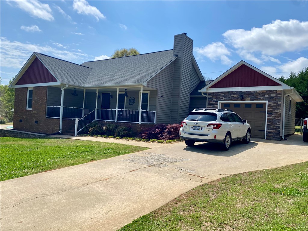 210 Twin Lakes Drive Anderson, SC 29621 - Photo 2 of 44 A charming home boasts a welcoming porch and convenient attached garage.