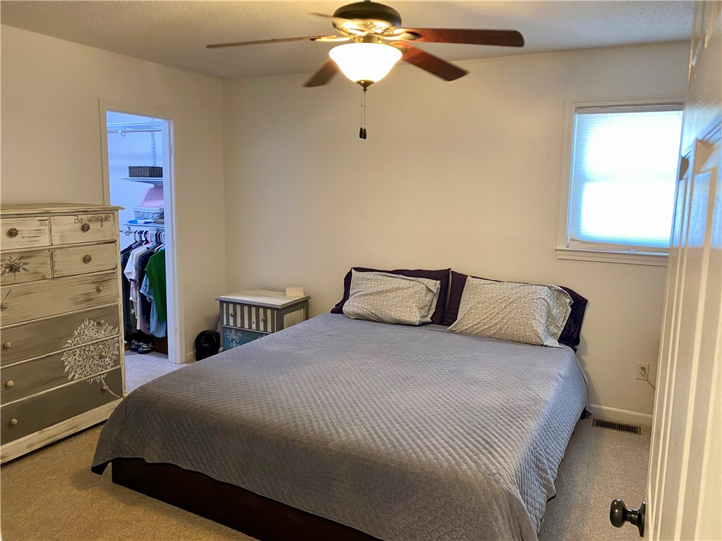 210 Twin Lakes Drive Anderson, SC 29621 - Photo 21 of 44 This serene bedroom offers comfortable living with a convenient walk-in closet.
