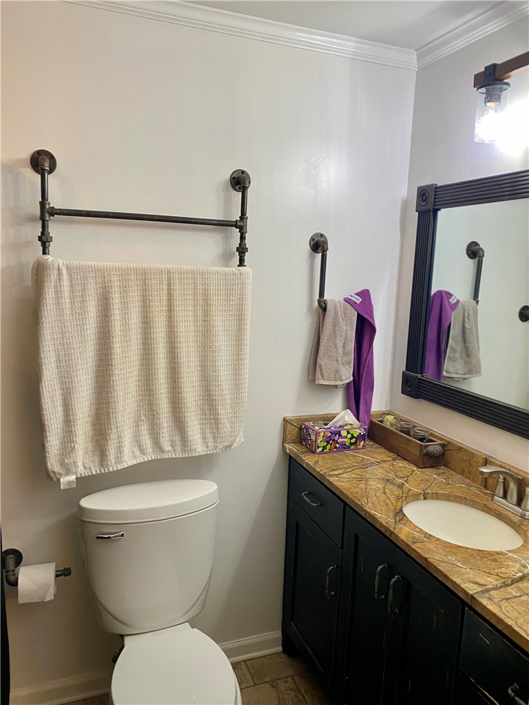 210 Twin Lakes Drive Anderson, SC 29621 - Photo 24 of 44 This bathroom features a contemporary vanity with a unique countertop and a functional toilet area.