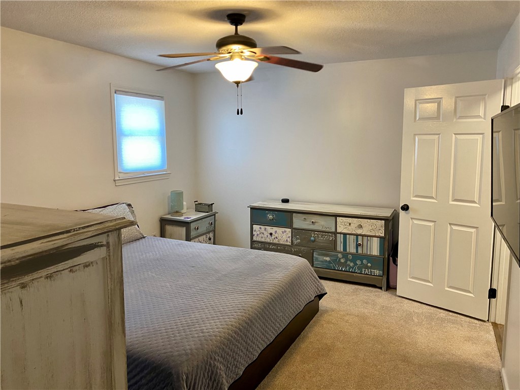 210 Twin Lakes Drive Anderson, SC 29621 - Photo 25 of 44 This cozy room offers a comfortable and inviting atmosphere, perfect for rest and relaxation.