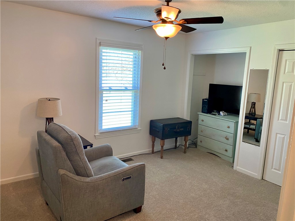 210 Twin Lakes Drive Anderson, SC 29621 - Photo 27 of 44 This cozy bedroom offers a tranquil retreat with soft lighting and ample space.