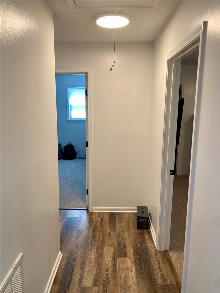 210 Twin Lakes Drive Anderson, SC 29621 - Photo 30 of 44 This hallway features stylish wood flooring and leads to inviting rooms.