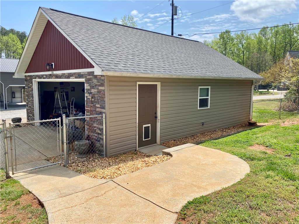 210 Twin Lakes Drive Anderson, SC 29621 - Photo 34 of 44 This functional garage offers practical utility and convenient outdoor access.