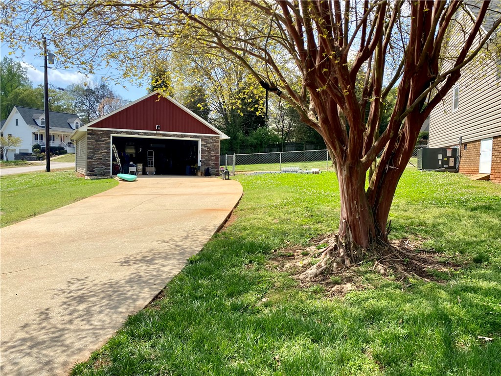 210 Twin Lakes Drive Anderson, SC 29621 - Photo 37 of 44 This property features a detached garage with ample space and a long, inviting driveway.