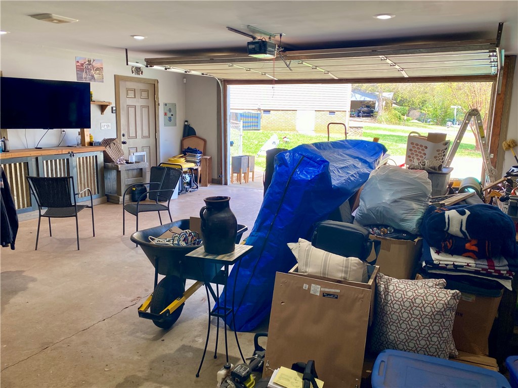 210 Twin Lakes Drive Anderson, SC 29621 - Photo 41 of 44 This garage offers versatile space with a roll-up door, ideal for storage or projects.