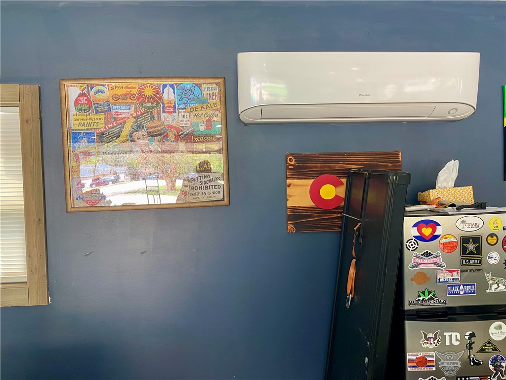 210 Twin Lakes Drive Anderson, SC 29621 - Photo 43 of 44 This interior image showcases a practical cooling unit on a blue wall.