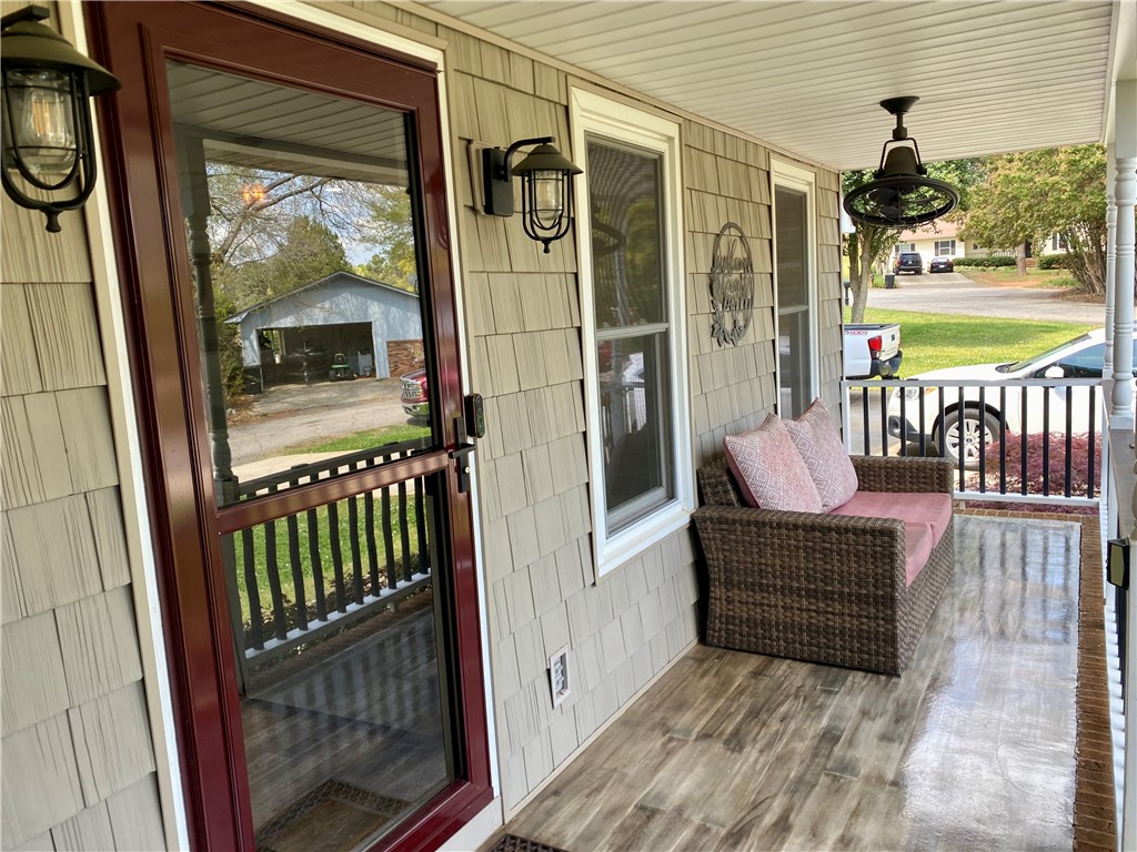 210 Twin Lakes Drive Anderson, SC 29621 - Photo 8 of 44 Enjoy quiet moments on this welcoming front porch, ideal for peaceful relaxation and neighborhood views.