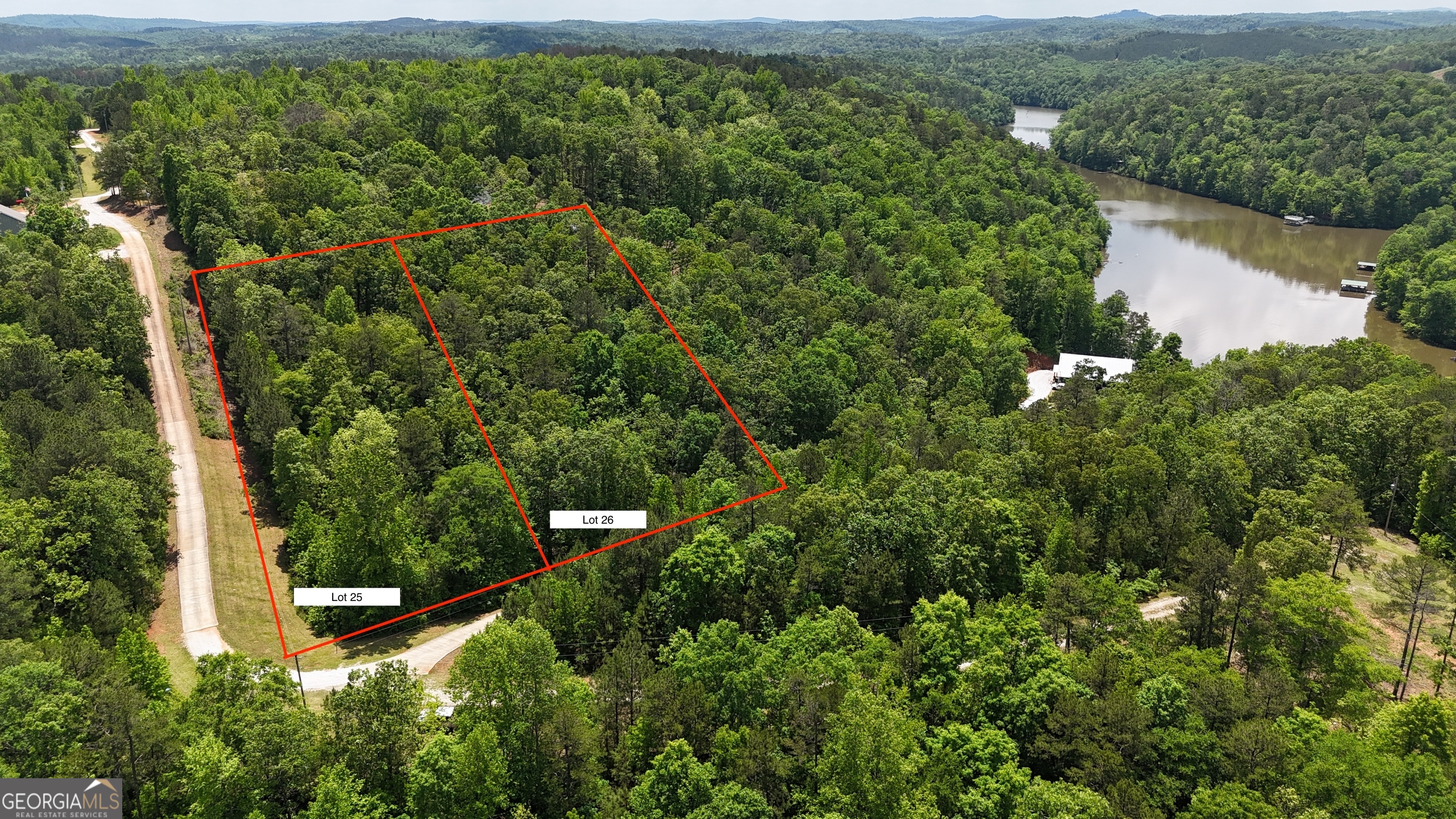 Lot 25 Sawyer Boat Ramp Road Wedowee, AL 36278 - Photo 2 of 2 an aerial view of a city with lots of residential buildings and mountain view in back