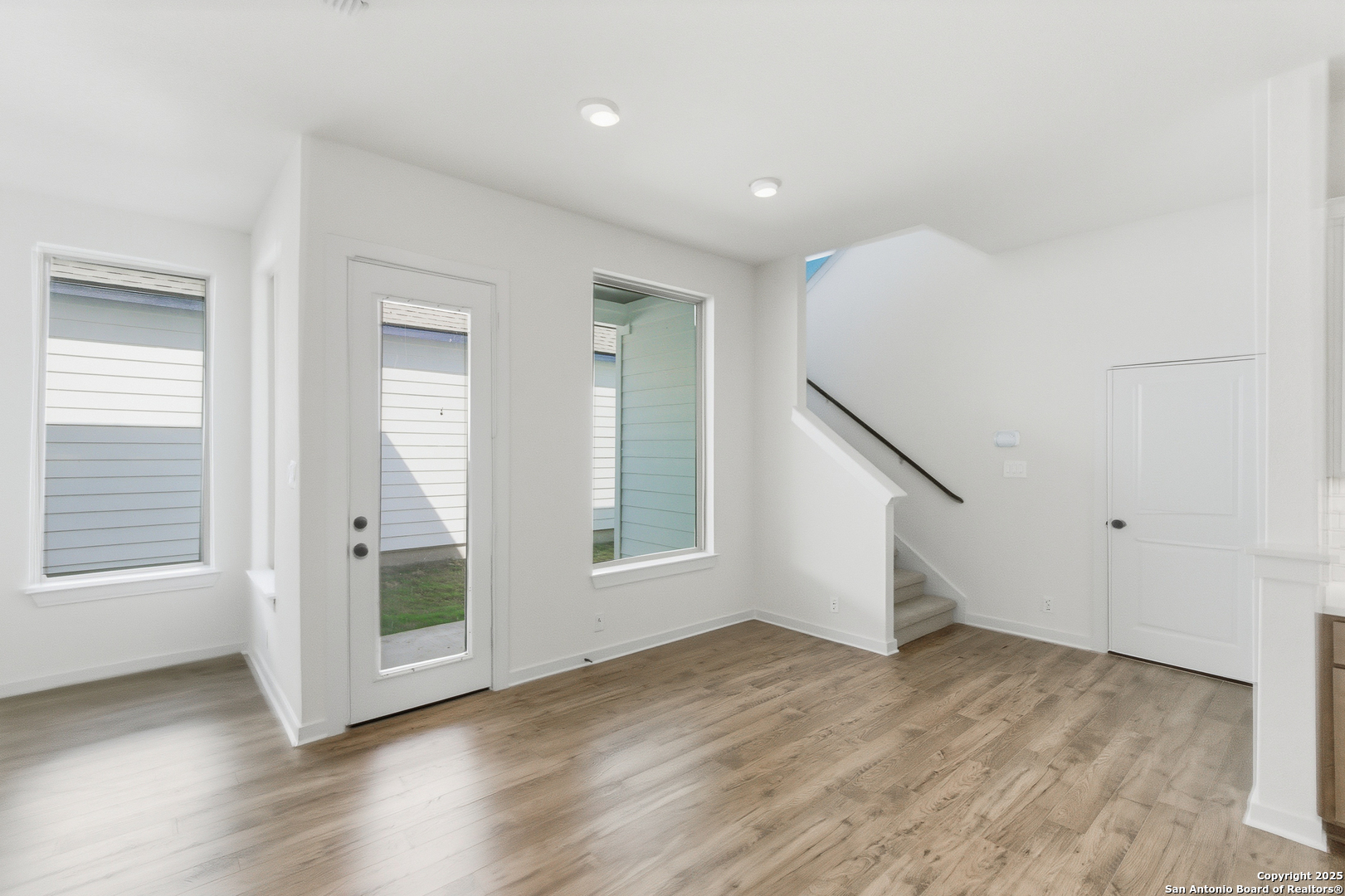 9421 Chatside Schertz, TX 78154 - Photo 29 of 48 an empty room with wooden floor and windows