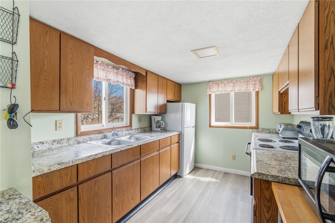 8393 Thrush Road Wolcott, NY 14590 - Photo 26 of 44 Kitchen with recent laminate flooring & counters